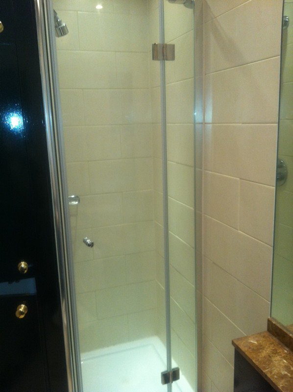 Frameless glass shower enclosure with chrome fittings in Slough