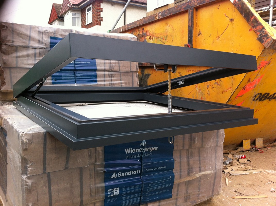 Opening flat roof skylight in anthracite grey installed in Slough